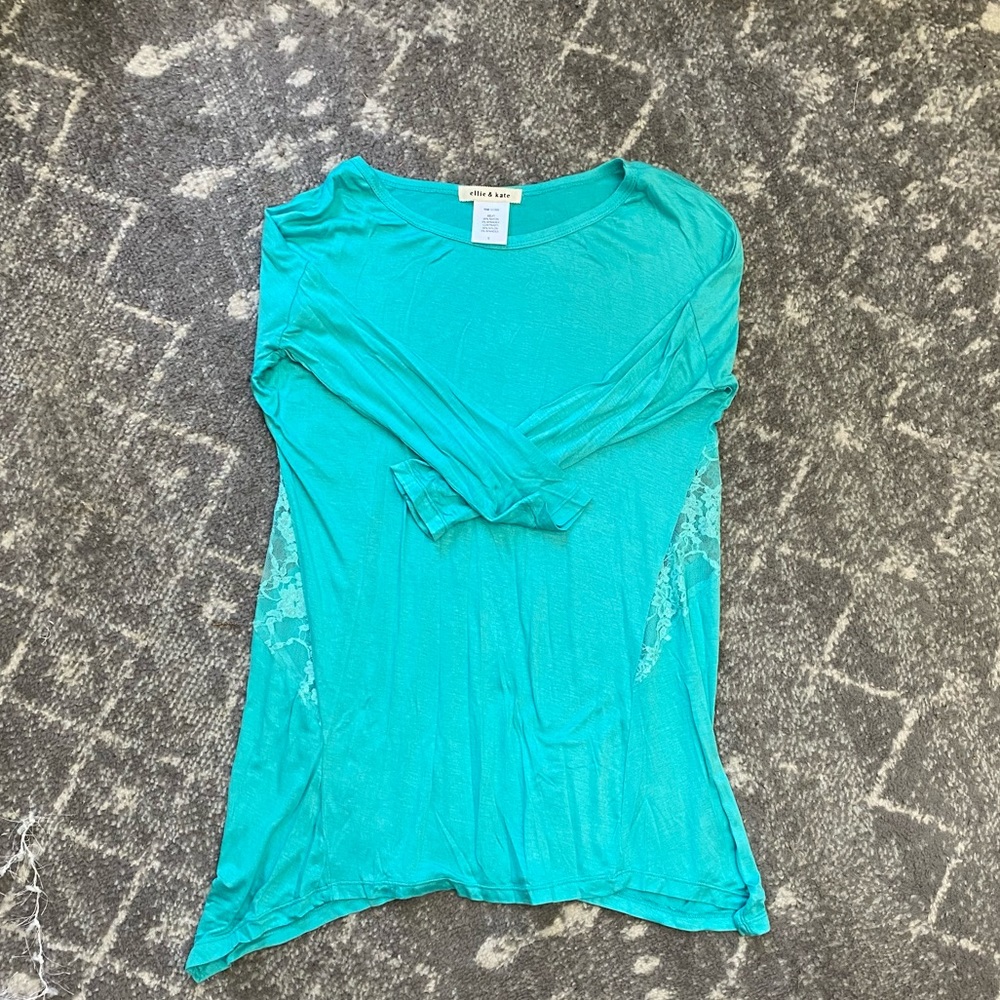 Teal long sleeve with mesh pattern on the back